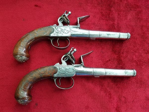 A fine pair of silver mounted English Queen Anne style flintlock box-lock pistols by Ketland & Co London. Good condition. Ref 9938.